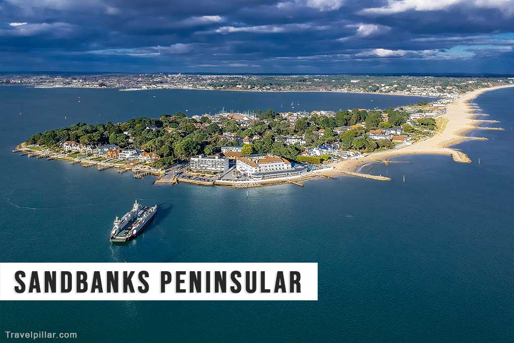 Aerial view of Sandbanks Peninsular at the entrance to Poole Harbour showing the Car Ferry in the foreground and the beautiful beaches to the right